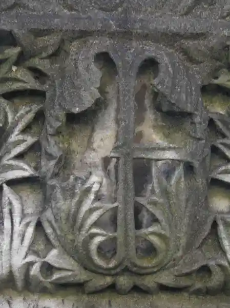 Cross engraved on a stone with leaf design
